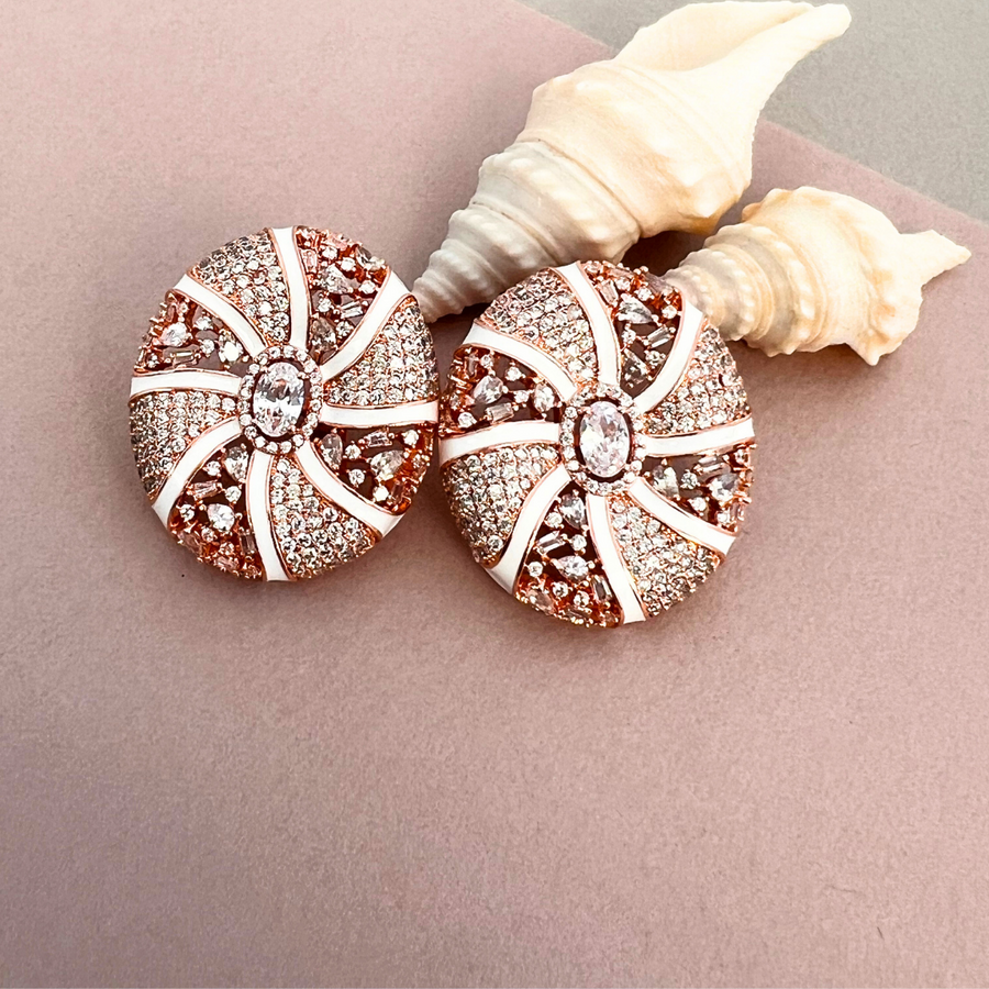 Pair of stunning pink and white diamond stud earrings.