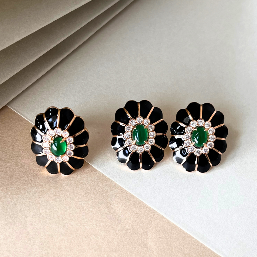 Three elegant earrings with black and green hues, adorned with sparkling diamonds for a touch of glamour.