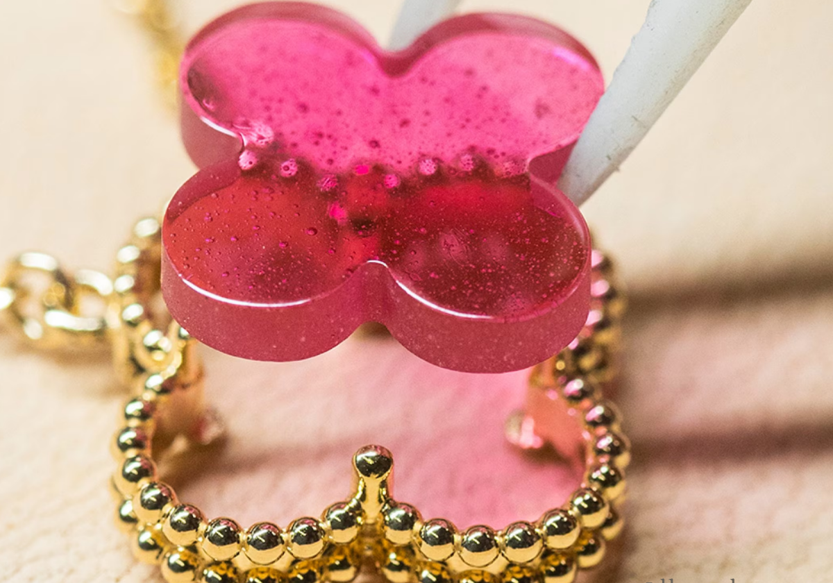 Van Cleef & Arpels Alhambra Collection — pink enamel four-leaf clover