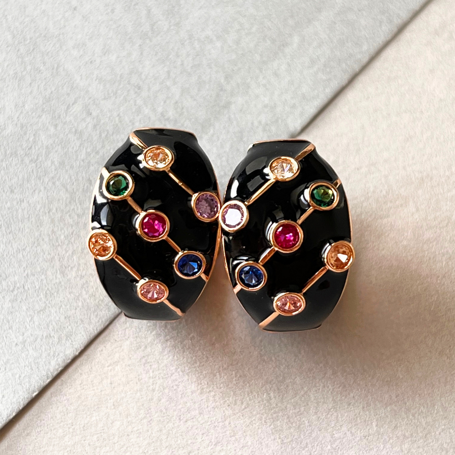 Black and gold hoop earrings with vibrant multi-colored stones.