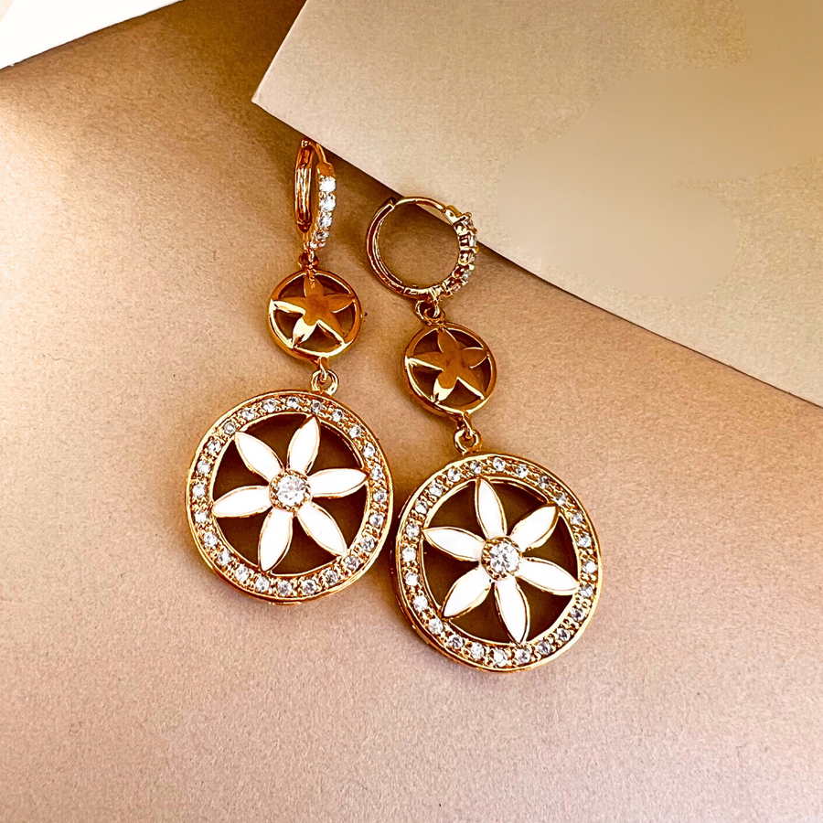 A stunning pair of gold and white diamond earrings, perfect for adding elegance and sparkle to any outfit.