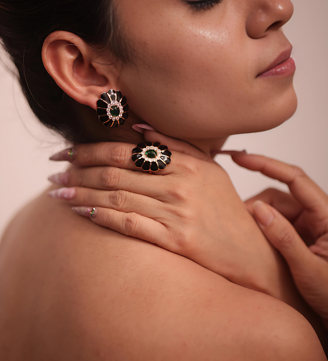 A woman wearing a stylish black and gold necklace, adding elegance and sophistication to her attire.