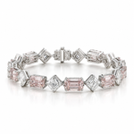 A silver-toned diamond and pink gemstone tennis bracelet with emerald-cut and round pink diamonds, displayed on a clean white background.