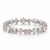 A silver-toned diamond and pink gemstone tennis bracelet with emerald-cut and round pink diamonds, displayed on a clean white background.