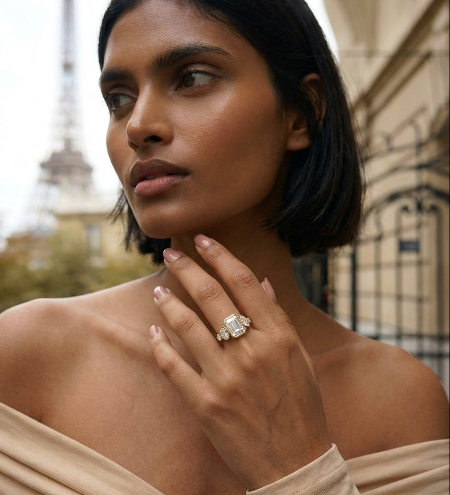 Woman wearing a diamond ring with the Eiffel Tower in the background